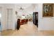 Open entryway leading to a brightly lit living room and dining area with tile floors and tasteful decor at 4108 Via Mirada, Sarasota, FL 34238