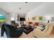 Cozy living room with comfortable seating, built-in shelving, and serene views of the outdoor patio at 4108 Via Mirada, Sarasota, FL 34238