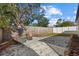 Enjoy the backyard featuring gravel, stone landscaping, a firepit, and ample space for outdoor activities at 4464 Gallup Ave, Sarasota, FL 34233