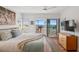 Bright bedroom with balcony access and ocean views at 4835 Gulf Of Mexico Dr # 302B, Longboat Key, FL 34228