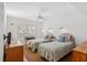 Bright bedroom featuring two twin beds, shuttered windows, and stylish decor at 4835 Gulf Of Mexico Dr # 302B, Longboat Key, FL 34228