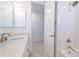 Bathroom with quartz countertops, tiled shower, and modern fixtures at 501 Tamiami N Trl # 601, Venice, FL 34285