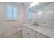 Bathroom with shaker cabinets, quartz countertops, tile flooring, and modern fixtures at 501 Tamiami N Trl # 601, Venice, FL 34285