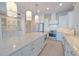 Bright kitchen featuring a large island, stainless steel appliances, and modern lighting fixtures at 501 Tamiami N Trl # 601, Venice, FL 34285