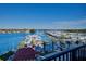 Stunning water views overlooking a marina with boats docked and a clear blue sky above at 501 Tamiami N Trl # 601, Venice, FL 34285