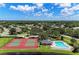 Overhead shot of tennis courts and pool by the lake in a residential area at 5103 73Rd E St, Bradenton, FL 34203