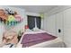 Cozy bedroom featuring a collection of plush toys and neutral wall paint at 5103 73Rd E St, Bradenton, FL 34203