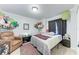 Bedroom with comfortable seating, colorful decor, and natural light at 5103 73Rd E St, Bradenton, FL 34203
