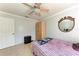 Bedroom showcasing a ceiling fan, wardrobe, and a tiled floor at 5103 73Rd E St, Bradenton, FL 34203