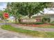 Exterior signage for Creekwood Lakeside II community, surrounded by lush landscaping and mature trees at 5103 73Rd E St, Bradenton, FL 34203