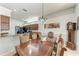 Dining room adjacent to kitchen with grandfather clock in the background at 5103 73Rd E St, Bradenton, FL 34203