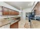 Well-lit kitchen featuring granite countertops and stainless steel appliances at 5103 73Rd E St, Bradenton, FL 34203