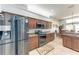 Open kitchen showcasing stainless steel appliances and a dining area at 5103 73Rd E St, Bradenton, FL 34203