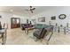 Inviting living room boasts tile flooring, comfortable sofas, and plenty of natural light at 5103 73Rd E St, Bradenton, FL 34203