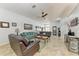 Comfortable living room with tiled floors, neutral color palette, and stylish furnishings at 5103 73Rd E St, Bradenton, FL 34203