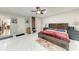 Spacious main bedroom featuring tiled floors, ceiling fan, and two closets at 5103 73Rd E St, Bradenton, FL 34203