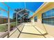 Enclosed patio featuring a light concrete floor and walls with an expansive view of the landscaped yard at 5103 73Rd E St, Bradenton, FL 34203