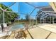 A screened-in patio featuring outdoor furniture and a view of the backyard at 5103 73Rd E St, Bradenton, FL 34203