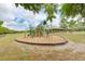 A fun-filled community playground features a wooden playset, perfect for to explore and enjoy outdoor play at 5103 73Rd E St, Bradenton, FL 34203