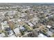 Aerial view of a residential neighborhood with mature trees and well-maintained lawns at 511 74Th N Ave, St Petersburg, FL 33702