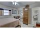 Bright bedroom with a full length mirror, ample storage, and ceiling fan at 511 74Th N Ave, St Petersburg, FL 33702