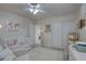 Bright Bedroom with a white crib, comfortable chair, and ample storage at 511 74Th N Ave, St Petersburg, FL 33702