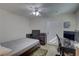 Functional bedroom with a twin bed, work desk and laminate flooring at 511 74Th N Ave, St Petersburg, FL 33702