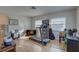 Versatile bonus room with a treadmill, desk, and ample natural light from multiple windows at 511 74Th N Ave, St Petersburg, FL 33702