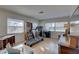 Spacious bonus room featuring a treadmill, desk, and lots of natural light through large windows at 511 74Th N Ave, St Petersburg, FL 33702