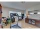 Bright bonus room with treadmill, desk, and storage, offering a flexible living space at 511 74Th N Ave, St Petersburg, FL 33702