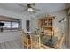 Cozy dining room with a black table, wooden chairs, and a lovely display cabinet at 511 74Th N Ave, St Petersburg, FL 33702