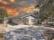 Charming home exterior features neutral paint, mature landscaping, and a long driveway at 511 74Th N Ave, St Petersburg, FL 33702