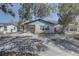 Charming single-story home with a mix of siding and brick and a bench on the front porch at 511 74Th N Ave, St Petersburg, FL 33702
