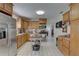 Functional kitchen featuring oak cabinetry, stainless steel appliances, and plenty of counter space at 511 74Th N Ave, St Petersburg, FL 33702