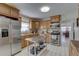 Well-equipped kitchen featuring stainless steel appliances, a movable island, and ample cabinet space at 511 74Th N Ave, St Petersburg, FL 33702