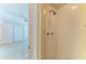 Shower with tile surround is located in the bathroom adajacent to the bedroom with ample lighting at 5400 Gulf Dr # 35, Holmes Beach, FL 34217