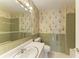 Bathroom featuring tile floors, sink, toilet and a large mirror at 5400 Gulf Dr # 35, Holmes Beach, FL 34217