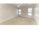 Bedroom features carpeted floors, ceiling fan and windows providing ample natural light at 5400 Gulf Dr # 35, Holmes Beach, FL 34217