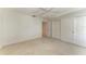 This carpeted bedroom has a ceiling fan, windows for natural light, and closet for storage at 5400 Gulf Dr # 35, Holmes Beach, FL 34217