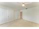 Bedroom featuring carpeted floors, ceiling fan, and spacious closet at 5400 Gulf Dr # 35, Holmes Beach, FL 34217