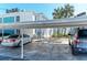 Assigned covered parking provides shade and protection for resident vehicles at 5400 Gulf Dr # 35, Holmes Beach, FL 34217