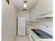 Efficient kitchen featuring white appliances and ample cabinet space, maximizing storage at 5400 Gulf Dr # 35, Holmes Beach, FL 34217