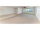 Bright living room featuring neutral carpet and a large window with ocean views at 5400 Gulf Dr # 35, Holmes Beach, FL 34217