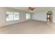 Sun-drenched living room with neutral carpet and multiple windows, offering plenty of light at 5400 Gulf Dr # 35, Holmes Beach, FL 34217