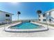 Sparkling pool offers a refreshing escape with ocean views and a serene setting at 5400 Gulf Dr # 35, Holmes Beach, FL 34217