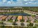 Stunning aerial view of the community showcasing lakefront homes and beautiful landscaping at 5656 Cantucci St, Nokomis, FL 34275