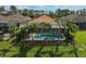 Backyard featuring a pool, patio furniture and lush landscaping at 5656 Cantucci St, Nokomis, FL 34275