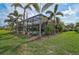 Landscaped backyard features a pool and lush landscaping at 5656 Cantucci St, Nokomis, FL 34275