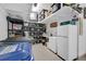 Organized basement with shelving, a deep freezer, and plenty of storage for a clutter-free home at 5656 Cantucci St, Nokomis, FL 34275