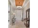 Bright foyer features recessed lighting, decorative rug and elegant decor at 5656 Cantucci St, Nokomis, FL 34275